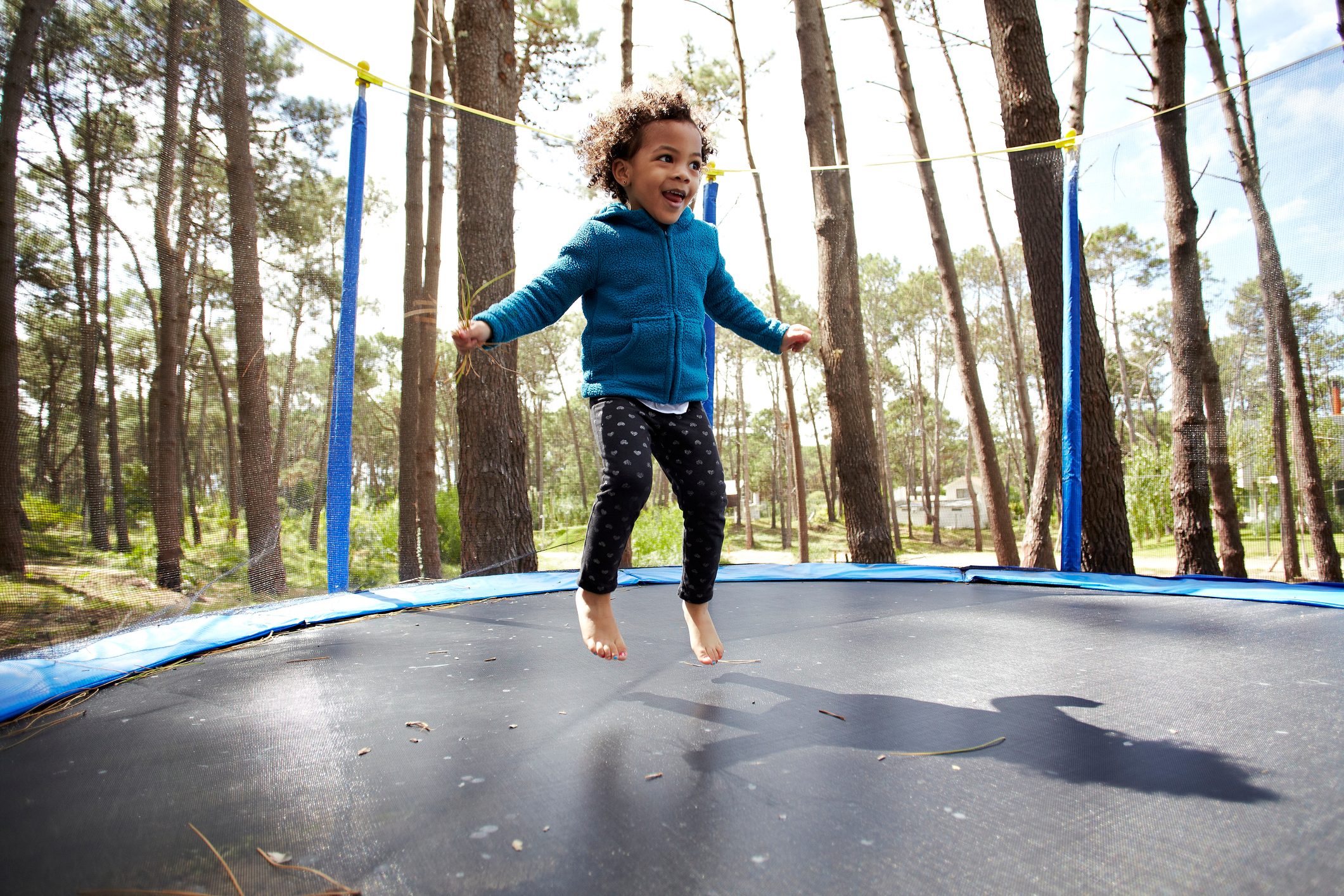 child jumping on the trampoline